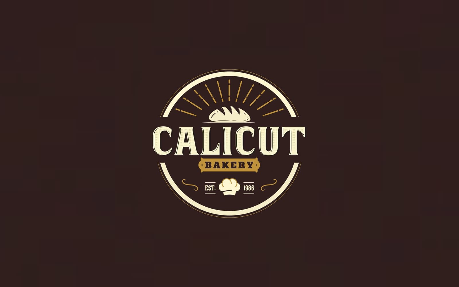 Calicut Bakery badge logo in cream and gold on dark brown.
