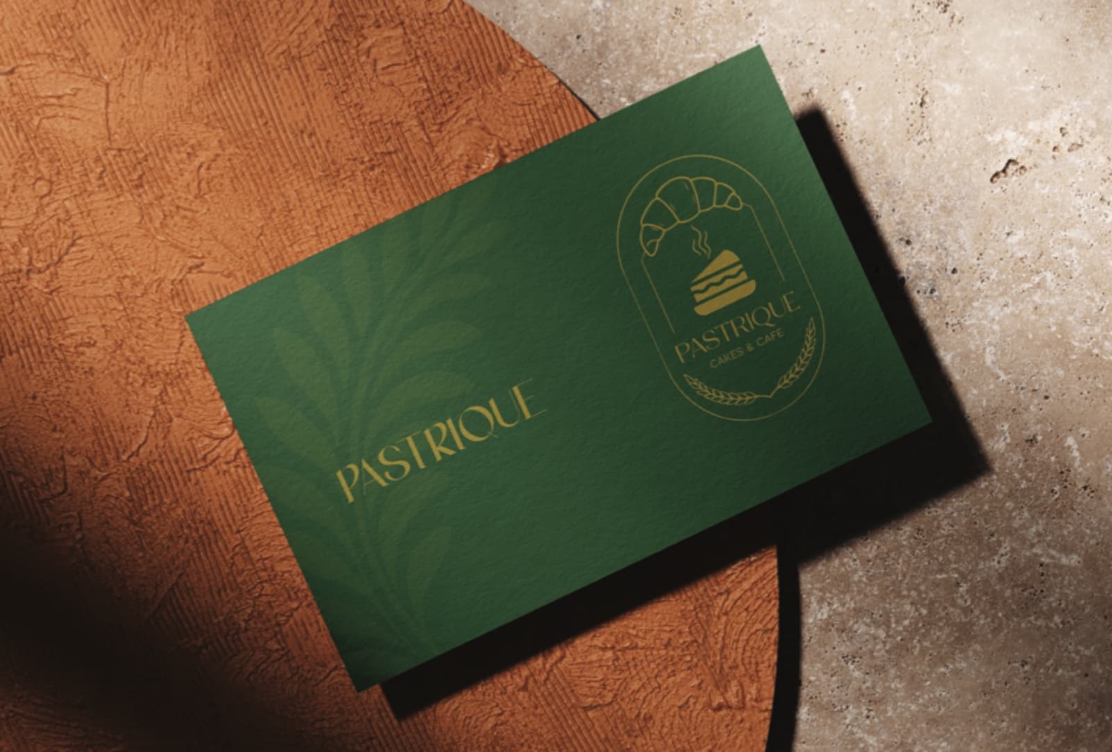 Pastrique business card in green and gold